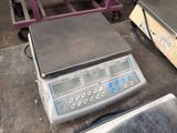 an image of a scale on a table in a warehouse