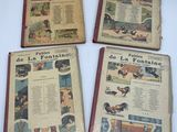 four books on a white table with pictures of people and animals on them