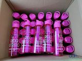 a box full of pink plastic water bottles sitting on top of each other