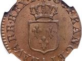 a close up of a coin with a crown on it