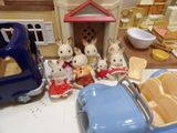 a toy car with a bunch of mice sitting in front of it