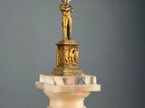 a statue of a man on top of a column