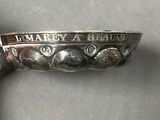 a close up of a silver spoon with a name engraved on it