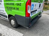 a van that is parked on the side of the road