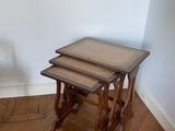 three tables that are sitting on a hard wood floor