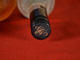 a close up of a bottle of wine on a table