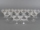 a large group of wine glasses sitting on a table