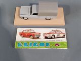 a toy car and a card on a table