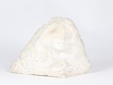 a white rock that is sitting on a white surface
