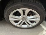 a close up of a tire on the side of a car