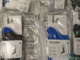 several pairs of socks are wrapped in plastic bags on a table