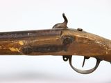an old gun with a wooden barrel and a metal handle