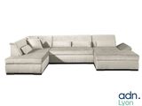 an image of a white sectional couch with pillows on it