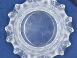 a clear glass plate on a blue cloth