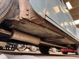 a close up view of a car under a vehicle