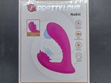 a box with a pink vibrating device inside of it