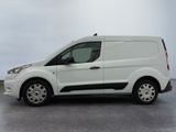the white van is parked on the concrete floor in the room