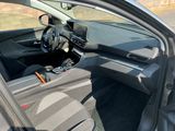 the interior of a car with the door open showing the steering wheel and dashboard