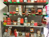a shelf with many different types of cigarettes on it
