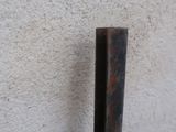 a close up of a metal pole on a wall