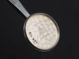 an image of a pan with a spoon in it