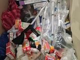a cardboard box filled with assorted items and cleaning supplies