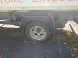 a truck that has a sign on the side of it