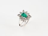 an emerald and diamond ring