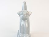 statue of a cat on a pedestal on a white background