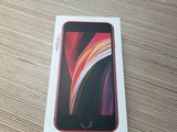the box is open on the table with the phone in it
