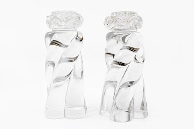pair of clear glass figurines of a woman and a man