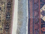 two rugs are laid out on the floor in a row