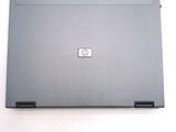 a laptop that is sitting on a white surface