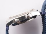 a close up of a watch with a rope around it