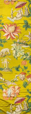 un gros plan d'un parapluie jaune orné de fleurs