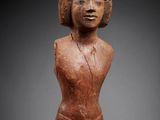 a statue of a woman in a brown dress