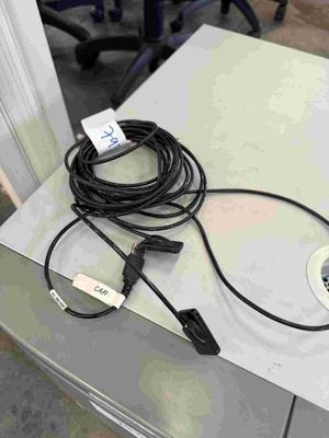 a table with a laptop and a charger on it