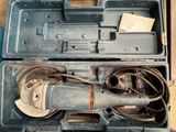a tool in the case that is sitting on the floor