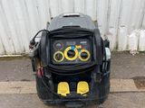 an image of a black and yellow machine on the ground