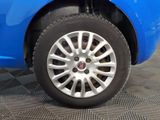 a close up of a tire on a blue car