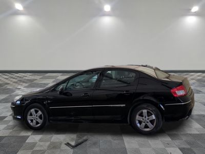 a picture of a black car parked in a garage
