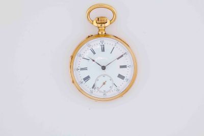 a gold pocket watch with roman numerals on it