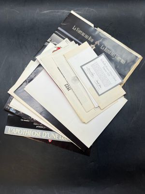 a pile of papers sitting on top of a black table