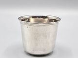 a silver cup with a handle on a white background