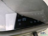 a close up of a digital clock on the side of a car