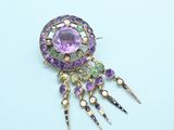 an image of a close up of a broochle on a white surface
