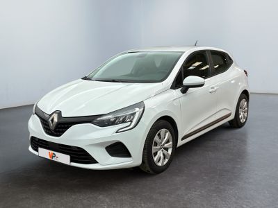 a white car is parked in a room with a black floor