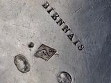 a silver plate with a stamp on it that says lafayette