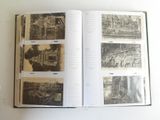 an open book on a table with pictures on it