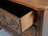 a wooden dresser with a drawer on top of it